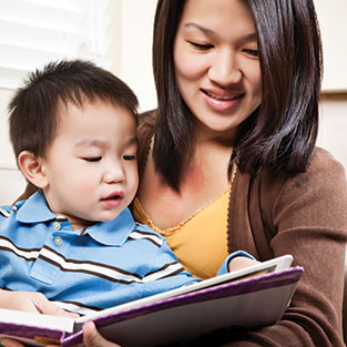 A mother reading to her baby. Links to Gifts by Will